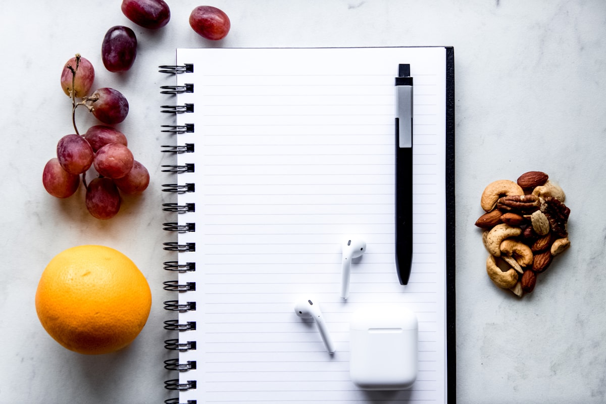 Healthy meal preparation workspace with fresh vegetables and ingredients